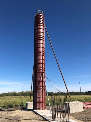 Tall modular column form standing on a jobsite