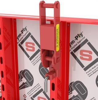 Close-up of a quick-connect clamp securing modular forming panels